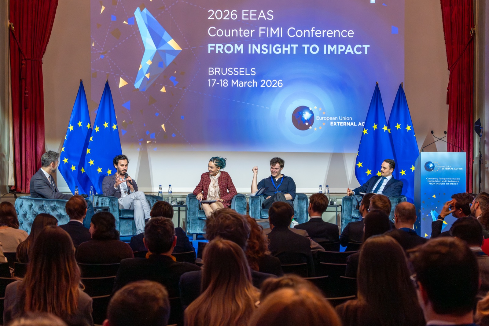 Carl Miller speaking on a panel at the 2026 EEAS Counter-FIMI Conference in Brussels