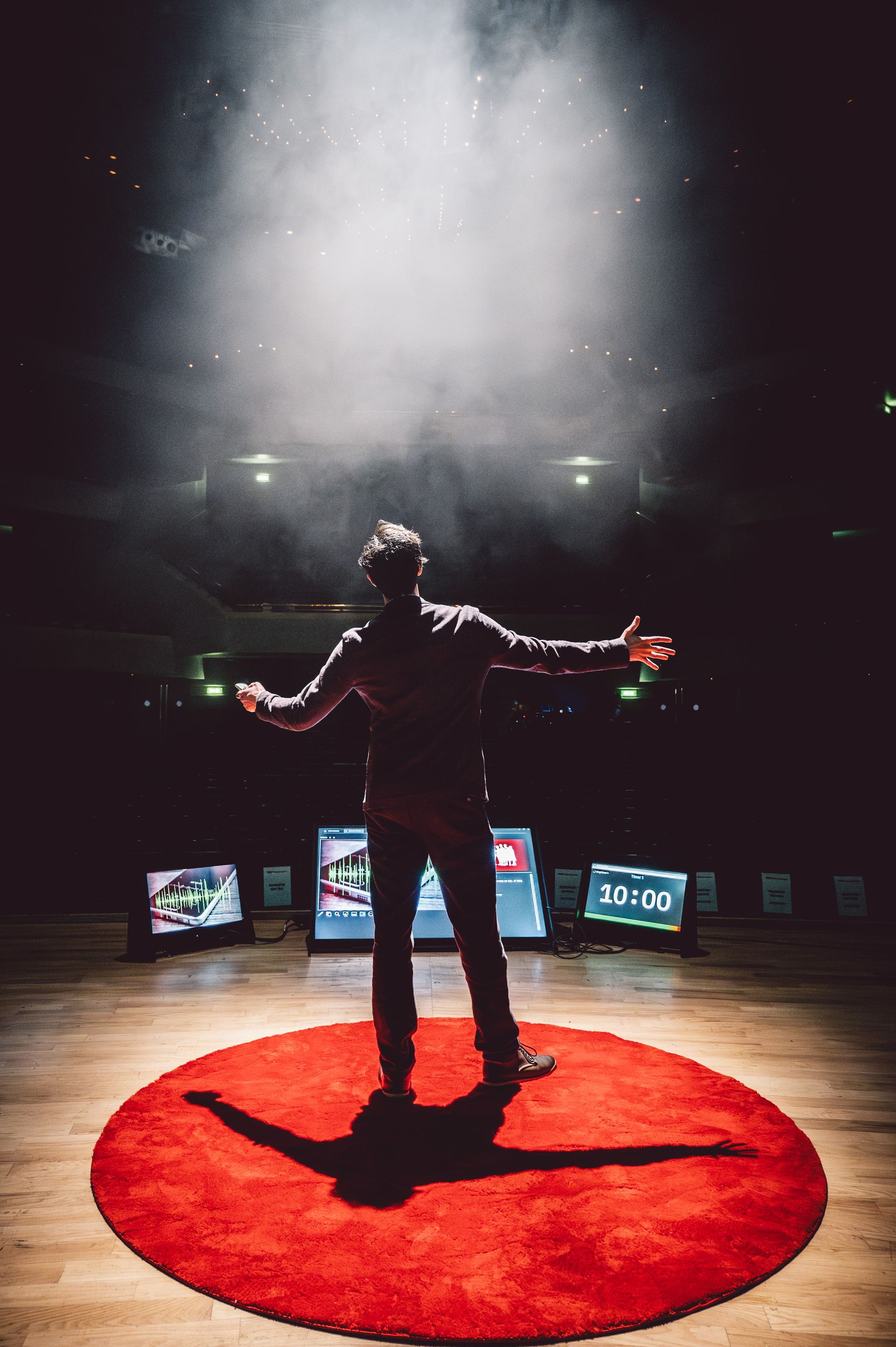 Carl Miller on stage giving his TED talk